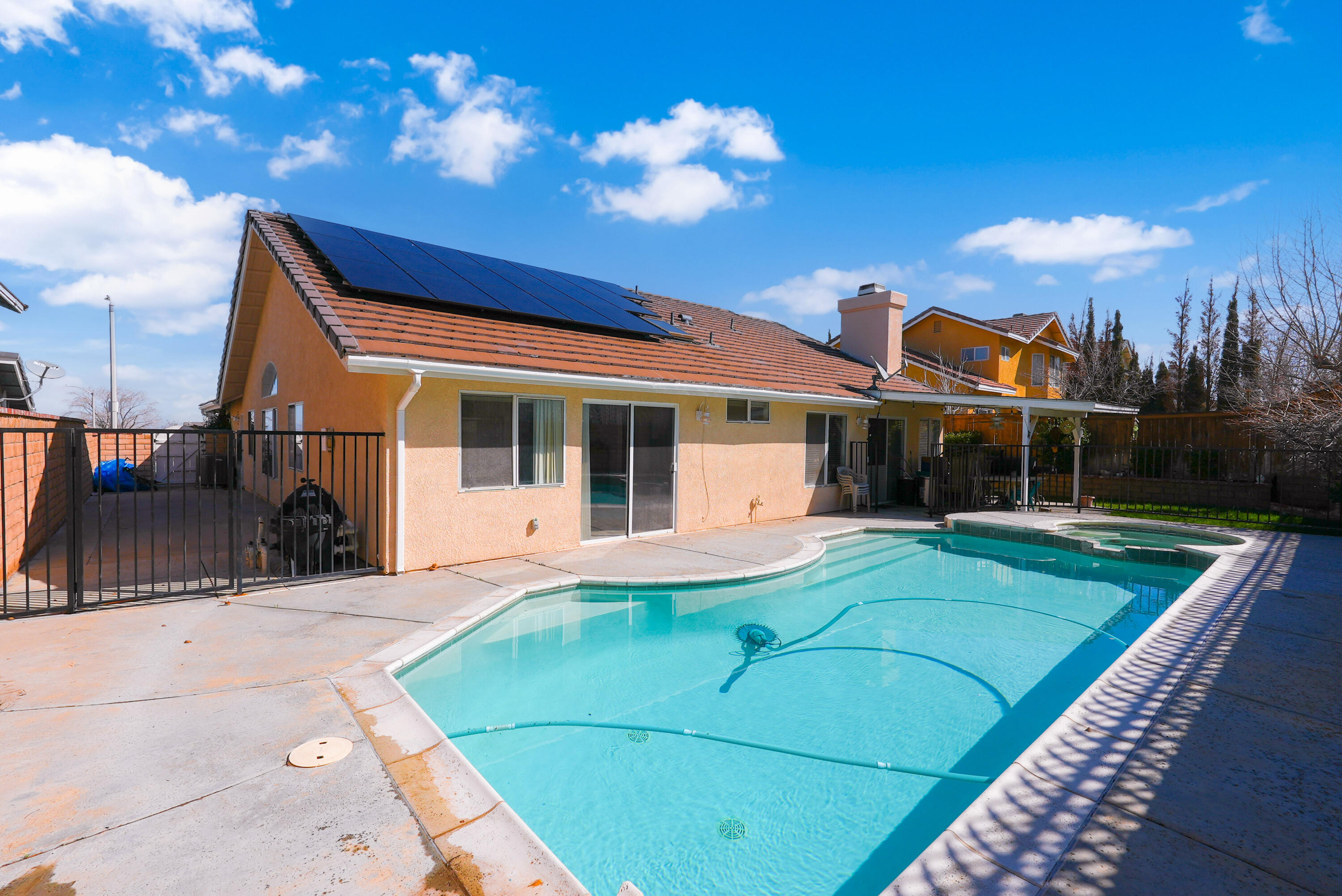 3030 Quarry Road Palmdale, CA 93550 - Photo 35 of 46 a view of a house with a backyard