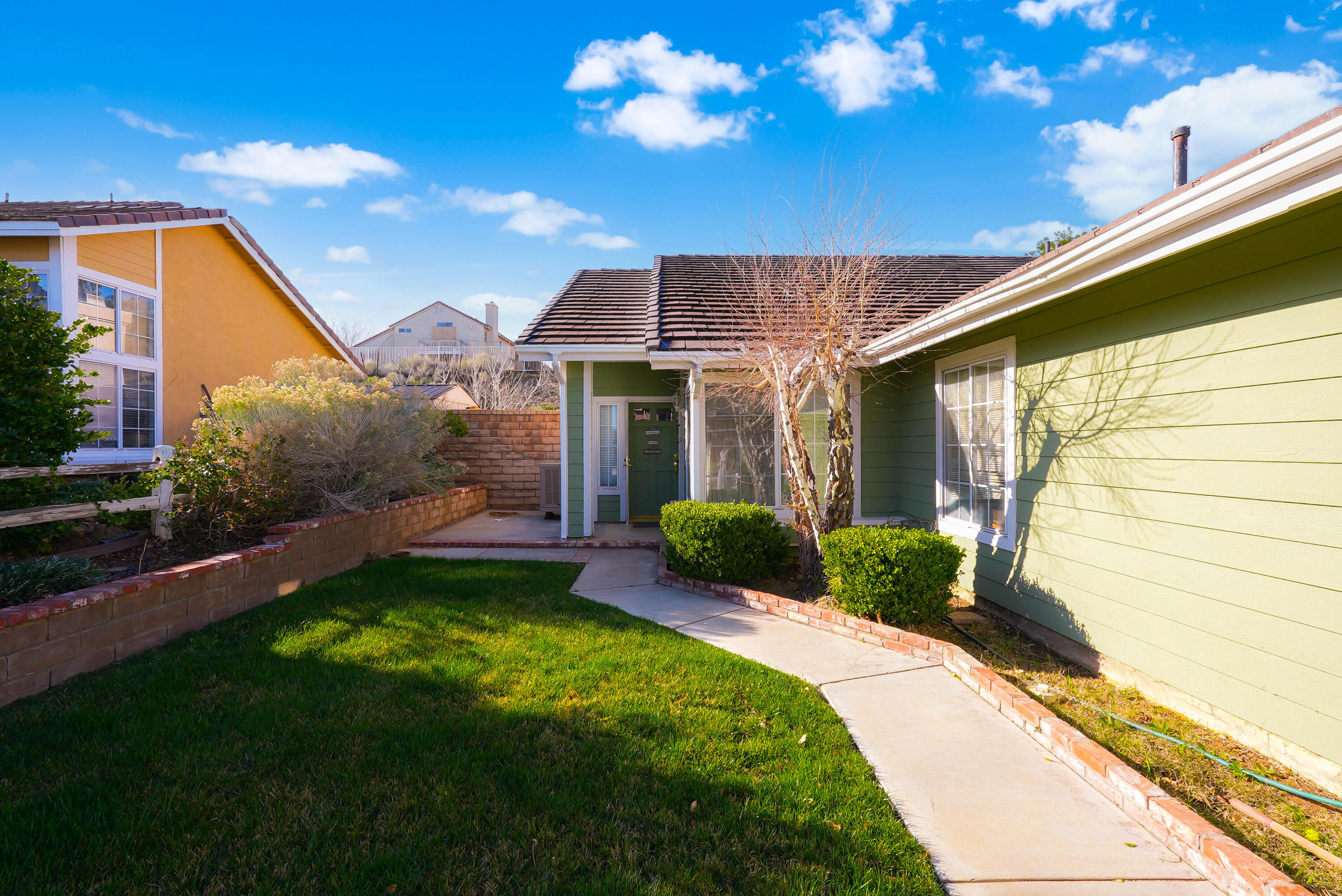 3030 Quarry Road Palmdale, CA 93550 - Photo 4 of 46 a view of a house with a backyard porch and sitting area