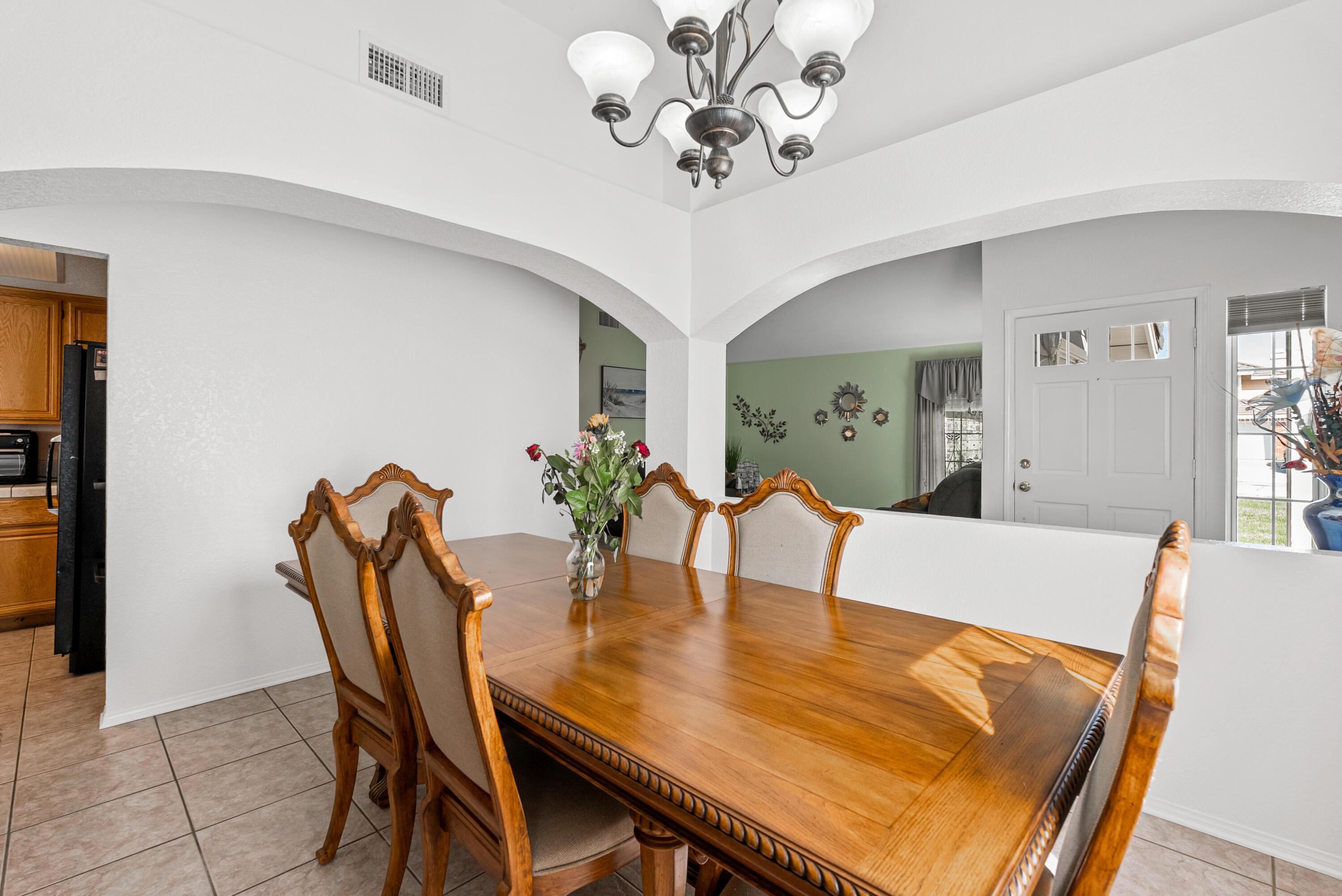 3030 Quarry Road Palmdale, CA 93550 - Photo 10 of 46 a view of a dining room with furniture and wooden floor