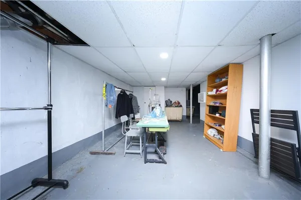 a view of a livingroom with furniture and a window
