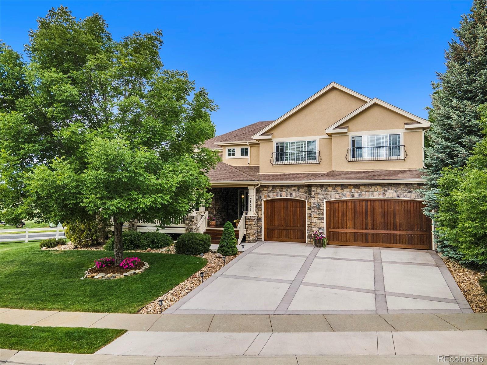 3822 Broadmoor Loop Broomfield, CO 80023 - Photo 1 of 40 a front view of a house with a yard and potted plants