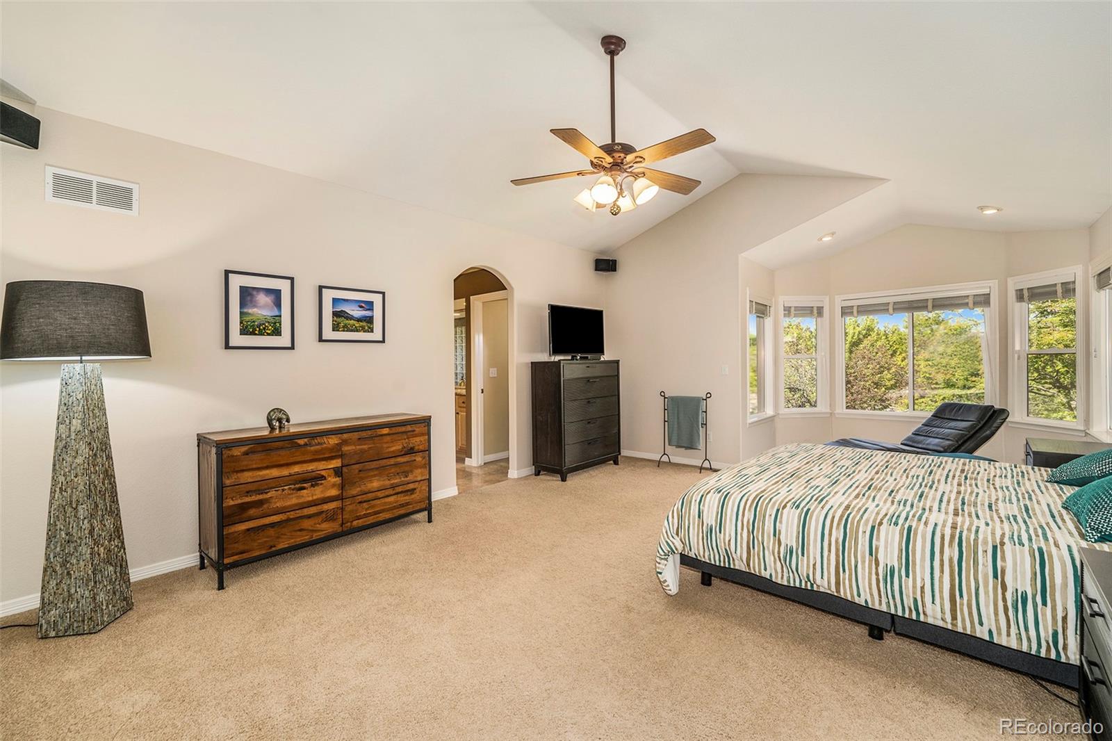 3822 Broadmoor Loop Broomfield, CO 80023 - Photo 24 of 40 a bedroom with a bed dresser and a window
