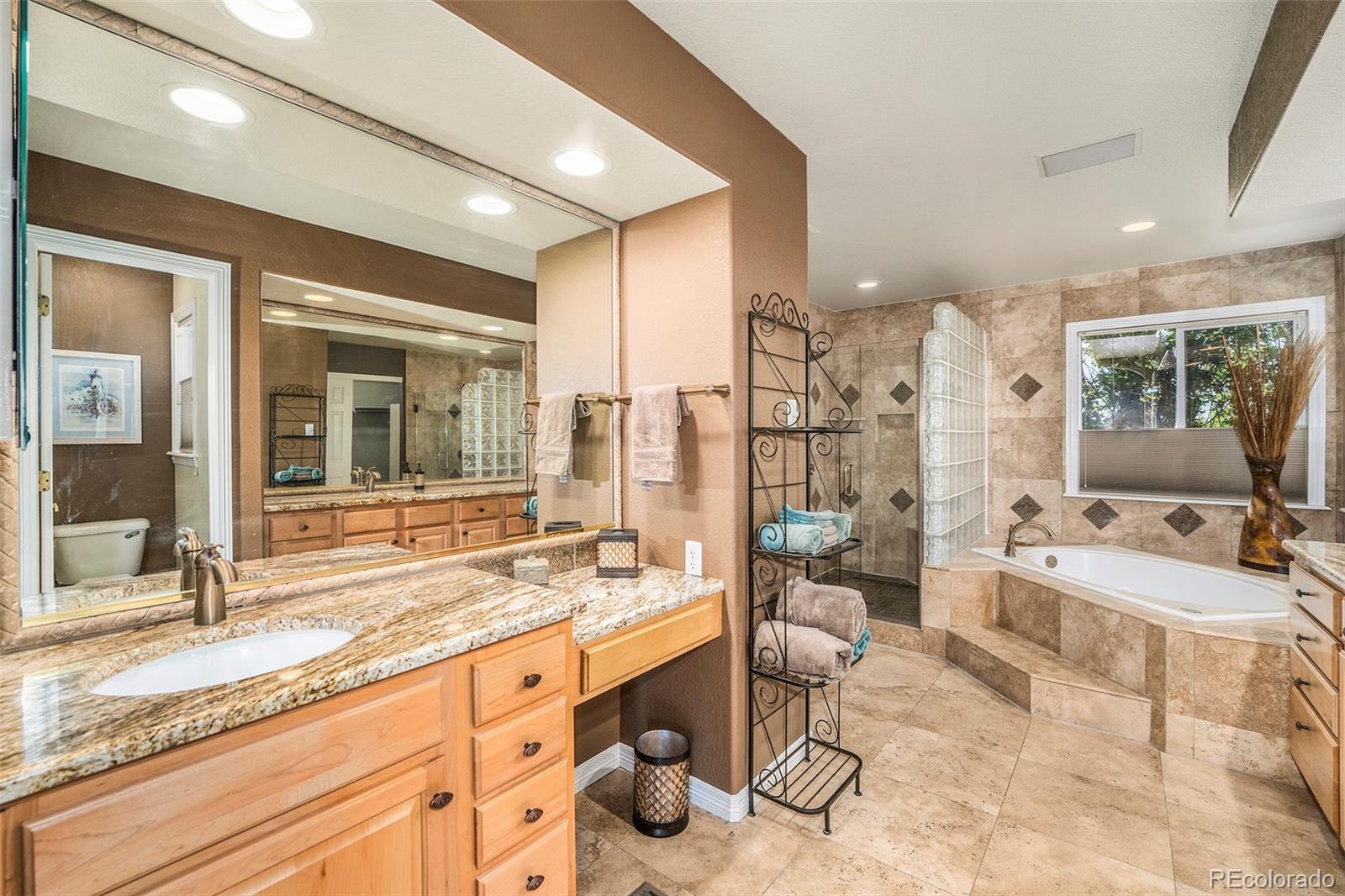 3822 Broadmoor Loop Broomfield, CO 80023 - Photo 27 of 40 a large bathroom with a large tub and sink