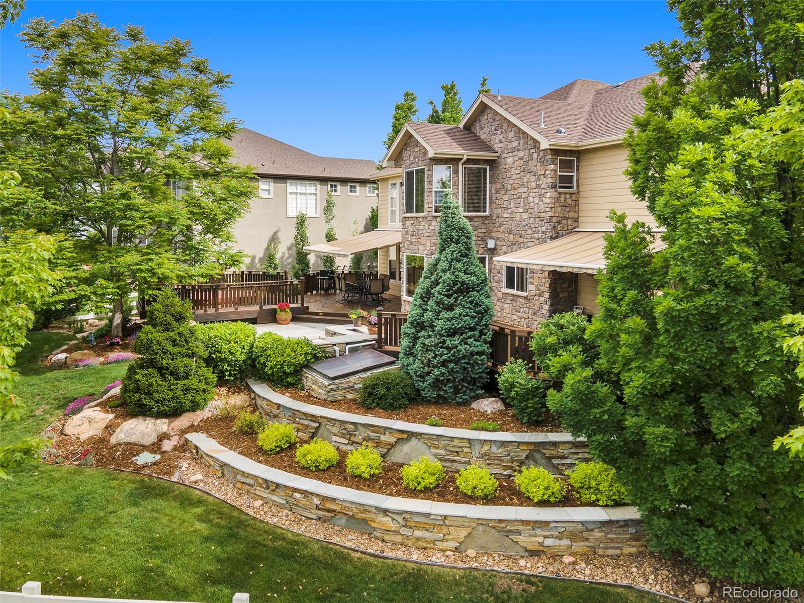 3822 Broadmoor Loop Broomfield, CO 80023 - Photo 8 of 40 a view of a house with swimming pool and a garden