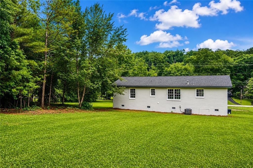 5598 Fosters Mill Road Cave Spring, GA 30124 - Photo 21 of 21 a front view of house with yard and green space