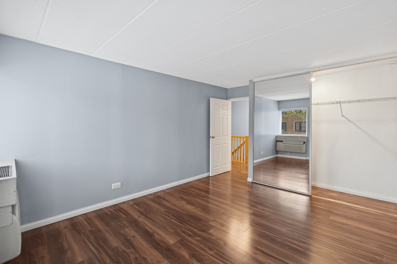 711 West Gordon Terrace, Unit 117 Chicago, IL 60613 - Photo 18 of 20 wooden floor in an empty room