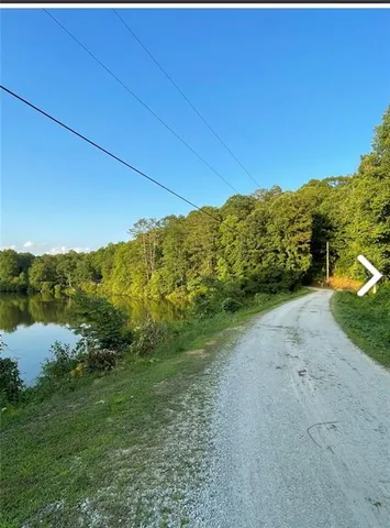 a view of a field with an ocean