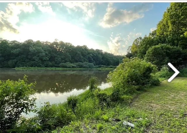 a view of lake with green space