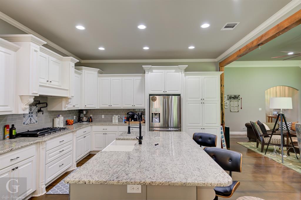 7453 Shirley Francis Road Shreveport, LA 71129 - Photo 14 of 30 a kitchen with granite countertop a sink stainless steel appliances and cabinets