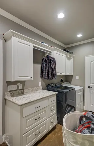 a bathroom with a granite countertop sink a mirror and a bathtub