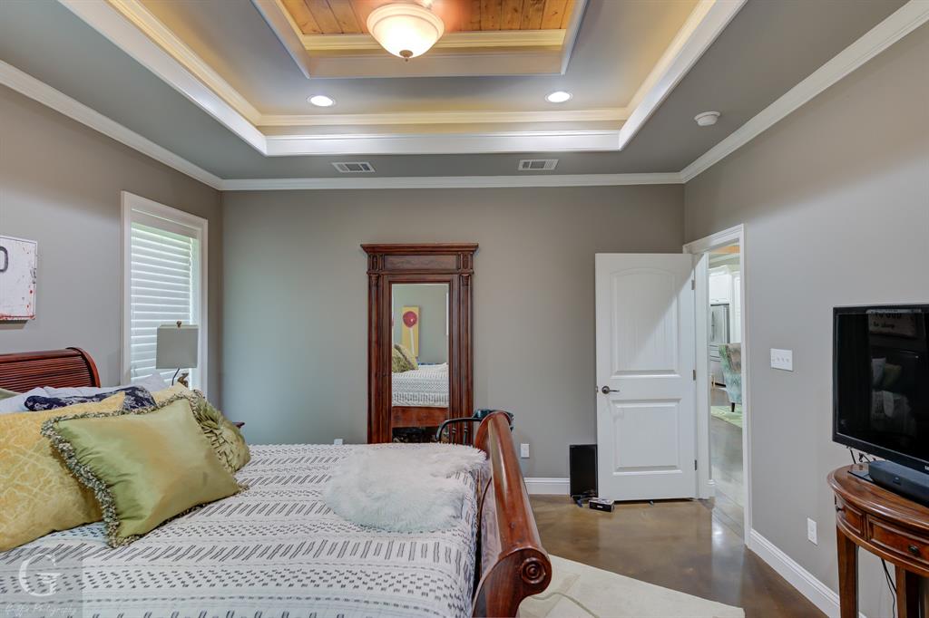 7453 Shirley Francis Road Shreveport, LA 71129 - Photo 18 of 30 a bedroom with a bed and a flat screen tv