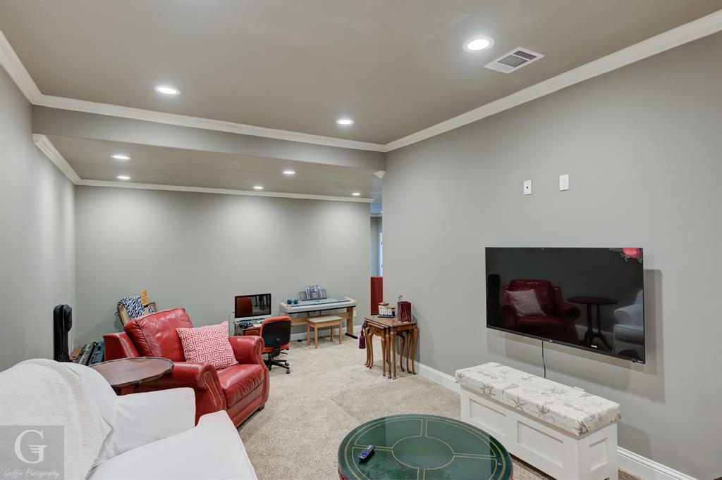 7453 Shirley Francis Road Shreveport, LA 71129 - Photo 25 of 30 a living room with furniture and a flat screen tv