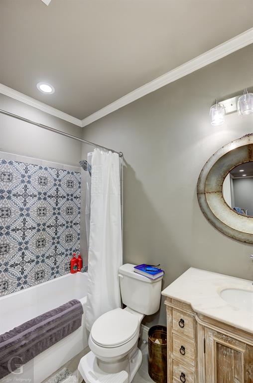 7453 Shirley Francis Road Shreveport, LA 71129 - Photo 26 of 30 a white toilet sitting next to a bathroom sink and a shower