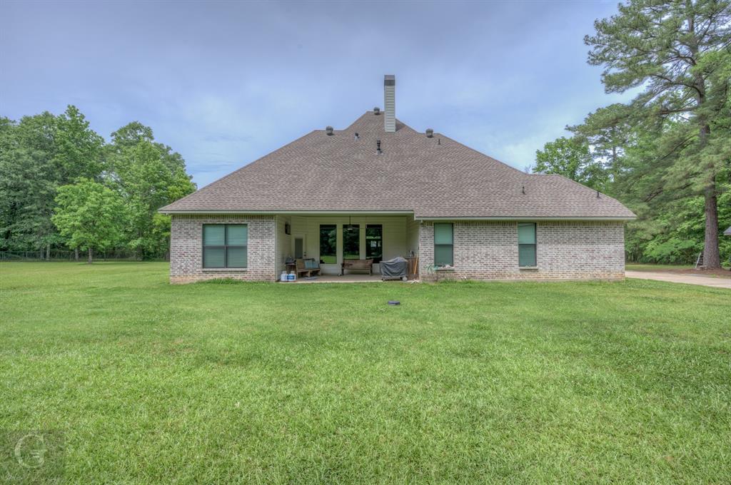7453 Shirley Francis Road Shreveport, LA 71129 - Photo 27 of 30 a front view of a house with a garden