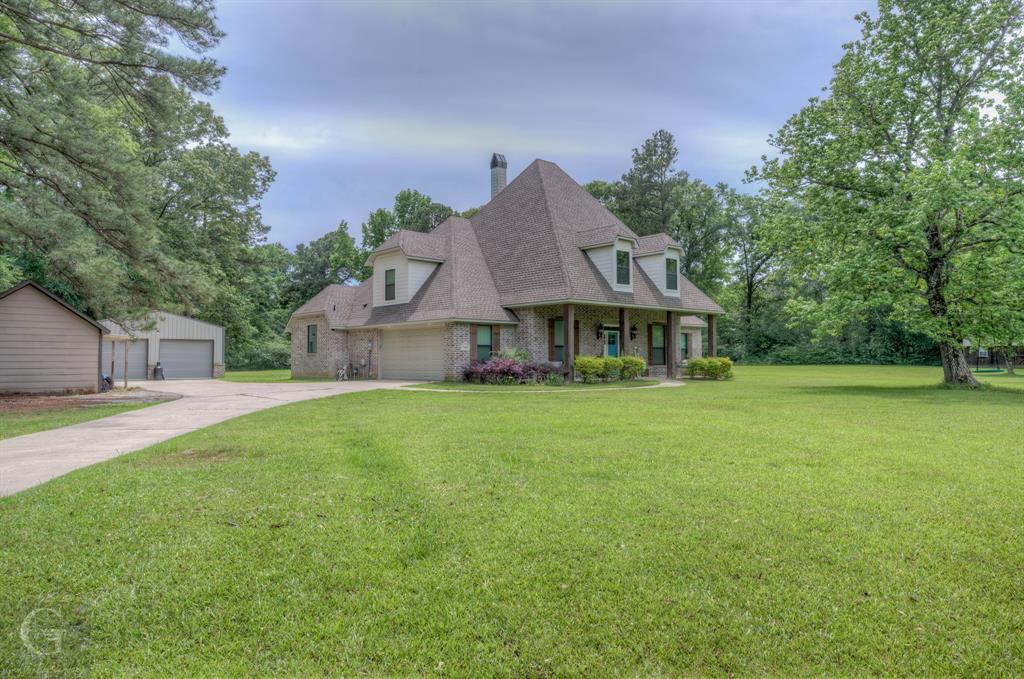 7453 Shirley Francis Road Shreveport, LA 71129 - Photo 3 of 30 a front view of house with yard and trees in the background