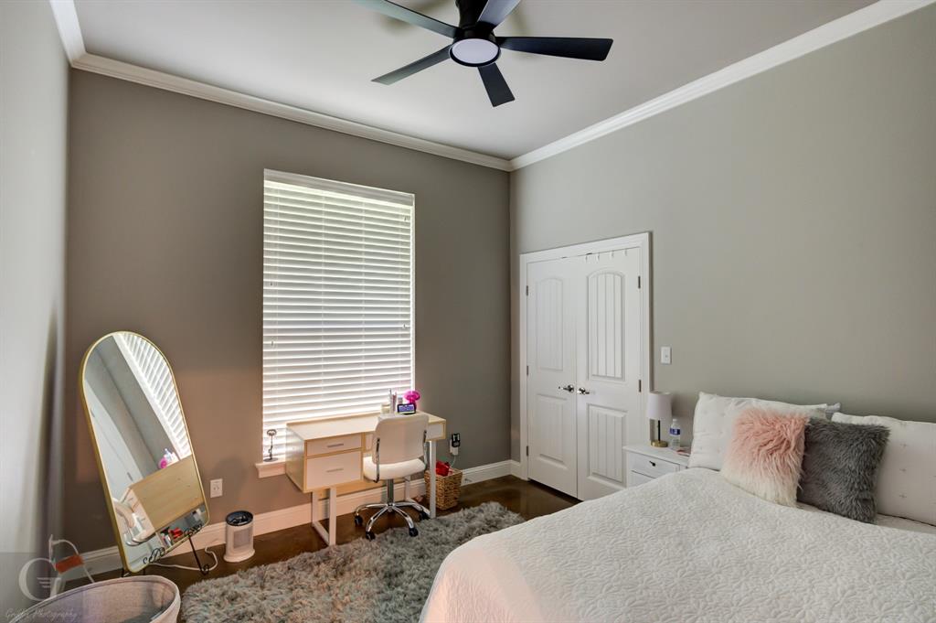 7453 Shirley Francis Road Shreveport, LA 71129 - Photo 7 of 30 a bedroom with a bed and a chandelier