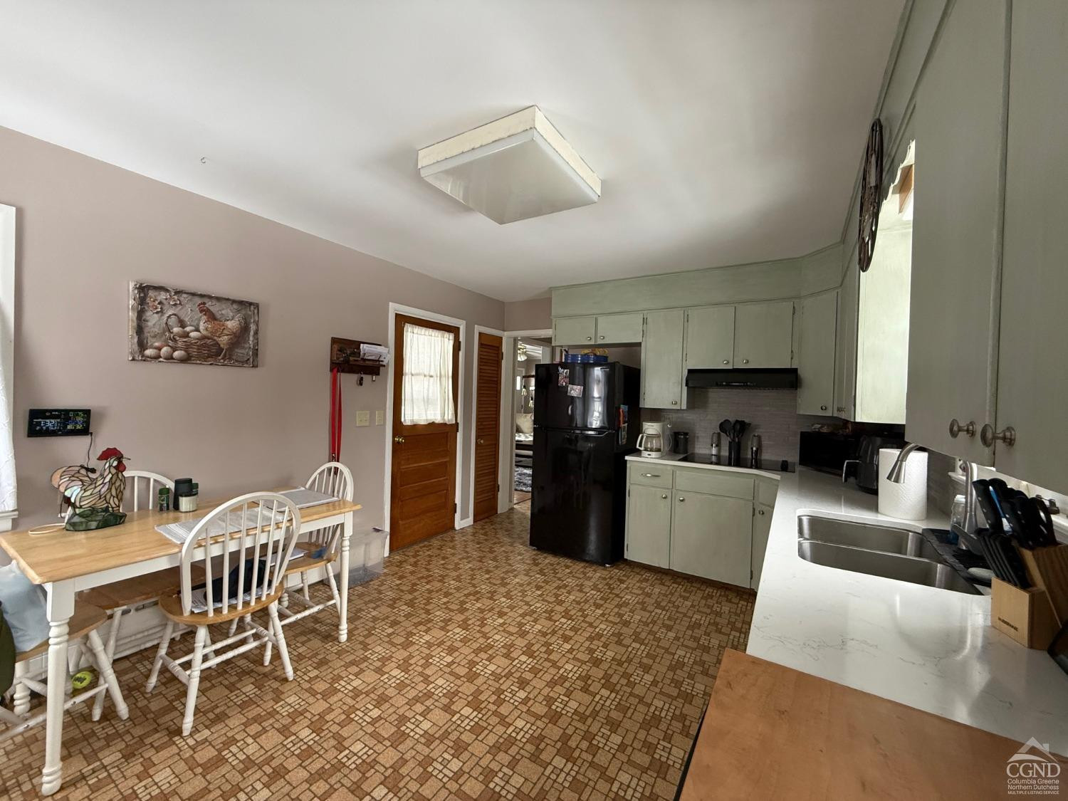 190 Beilke Road Millerton, NY 12546 - Photo 8 of 22 a kitchen with stainless steel appliances kitchen island granite countertop a refrigerator a stove a sink a dining table and chairs with wooden floor