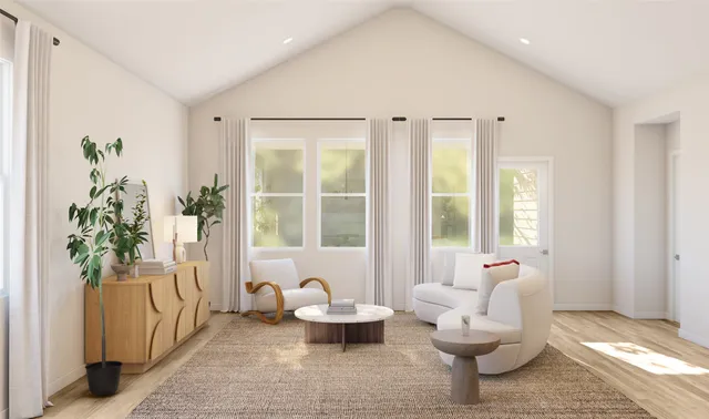 a living room with furniture and a potted plant