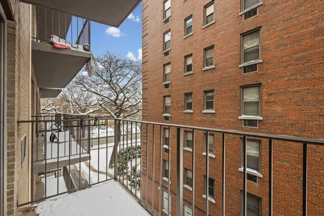 a view of a brick building from a balcony