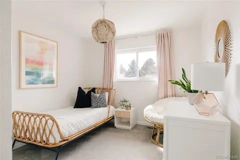 a bedroom with a bed and a table