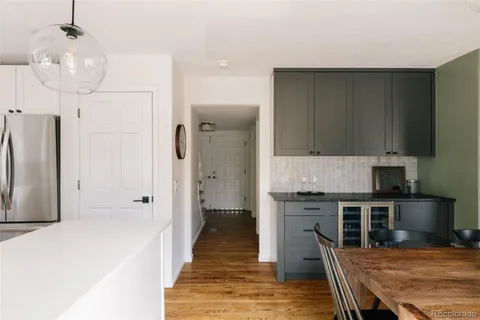 a kitchen with kitchen island a sink stainless steel appliances and cabinets