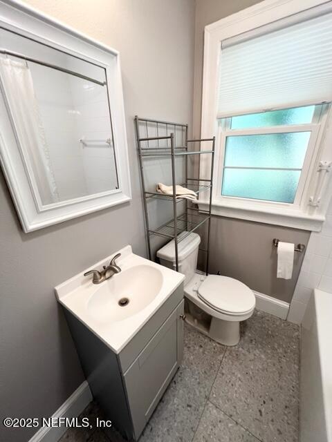 2144 Southampton Road Jacksonville, FL 32207 - Photo 13 of 27 a white toilet sitting next to a bathroom sink