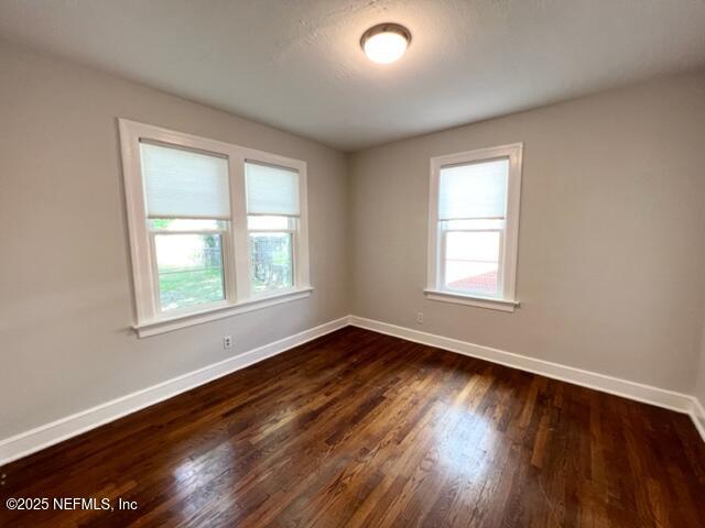 2144 Southampton Road Jacksonville, FL 32207 - Photo 15 of 27 a view of an empty room with wooden floor and a window