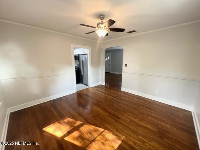 2144 Southampton Road Jacksonville, FL 32207 - Photo 17 of 27 a view of wooden floor and a chandelier fan in an empty room