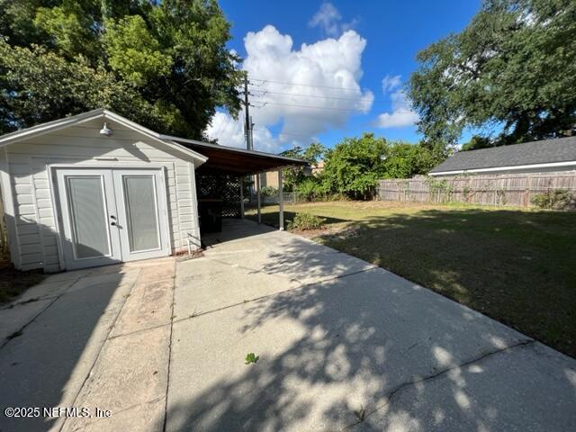 2144 Southampton Road Jacksonville, FL 32207 - Photo 23 of 27 a view of a grey house with a yard