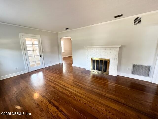 2144 Southampton Road Jacksonville, FL 32207 - Photo 3 of 27 a view of empty room with wooden floor and fireplace