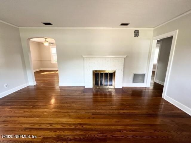 2144 Southampton Road Jacksonville, FL 32207 - Photo 4 of 27 a view of an empty room with wooden floor and a fireplace