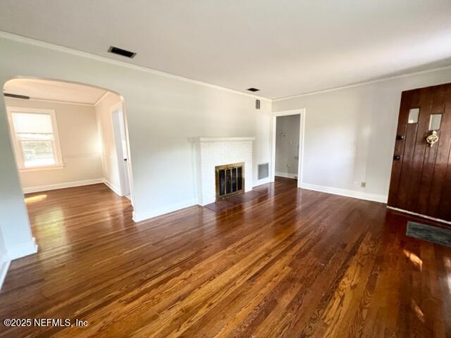 2144 Southampton Road Jacksonville, FL 32207 - Photo 5 of 27 wooden floor in an empty room with a window