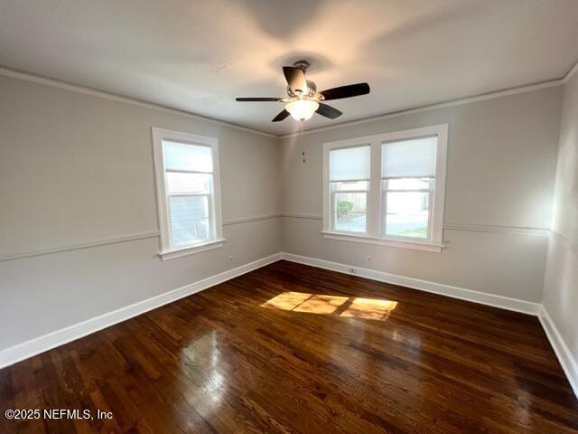2144 Southampton Road Jacksonville, FL 32207 - Photo 9 of 27 a view of an empty room with wooden floor and a window