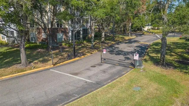 a view of backyard with swimming pool