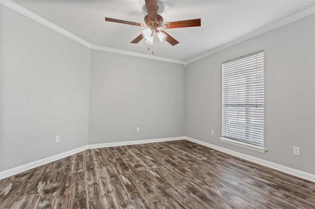 712 Billups Street Van Alstyne, TX 75495 - Photo 32 of 38 wooden floor in an empty room with a window
