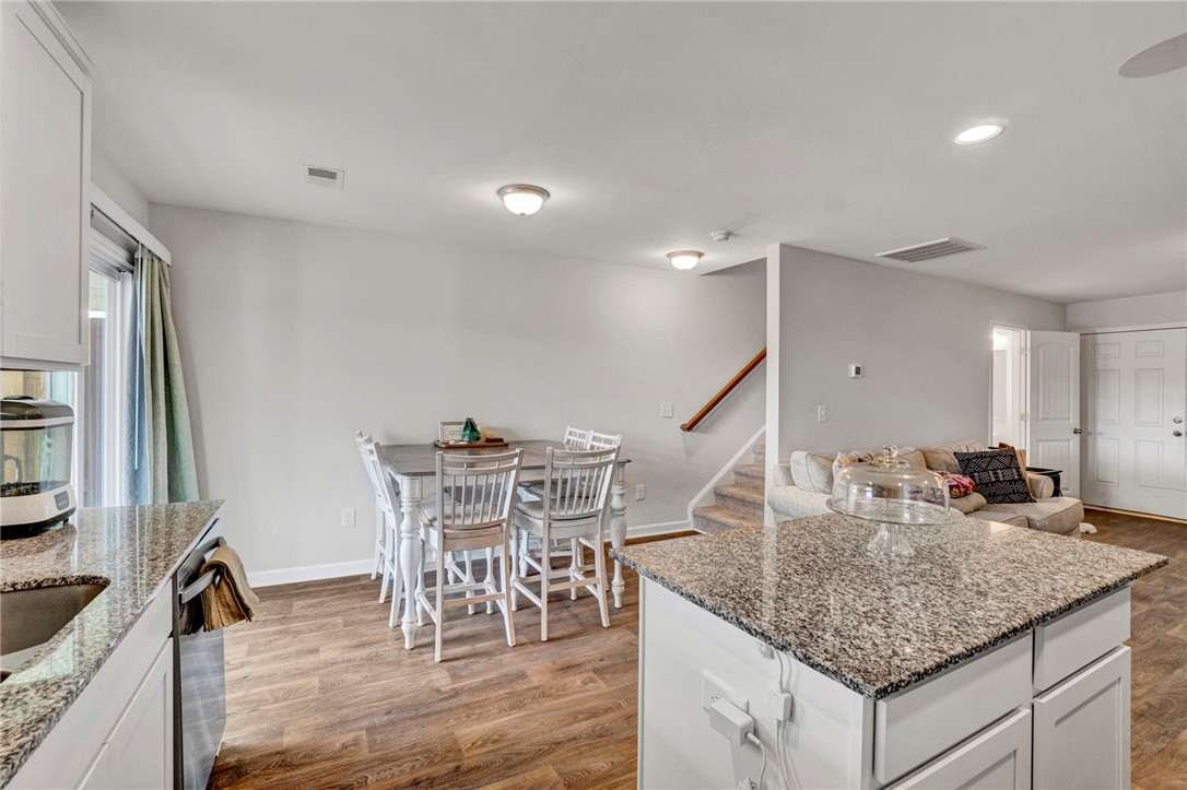 221 Samuel Street Pendleton, SC 29670 - Photo 13 of 34 This bright interior offers an open layout with durable flooring and ample space for gatherings.