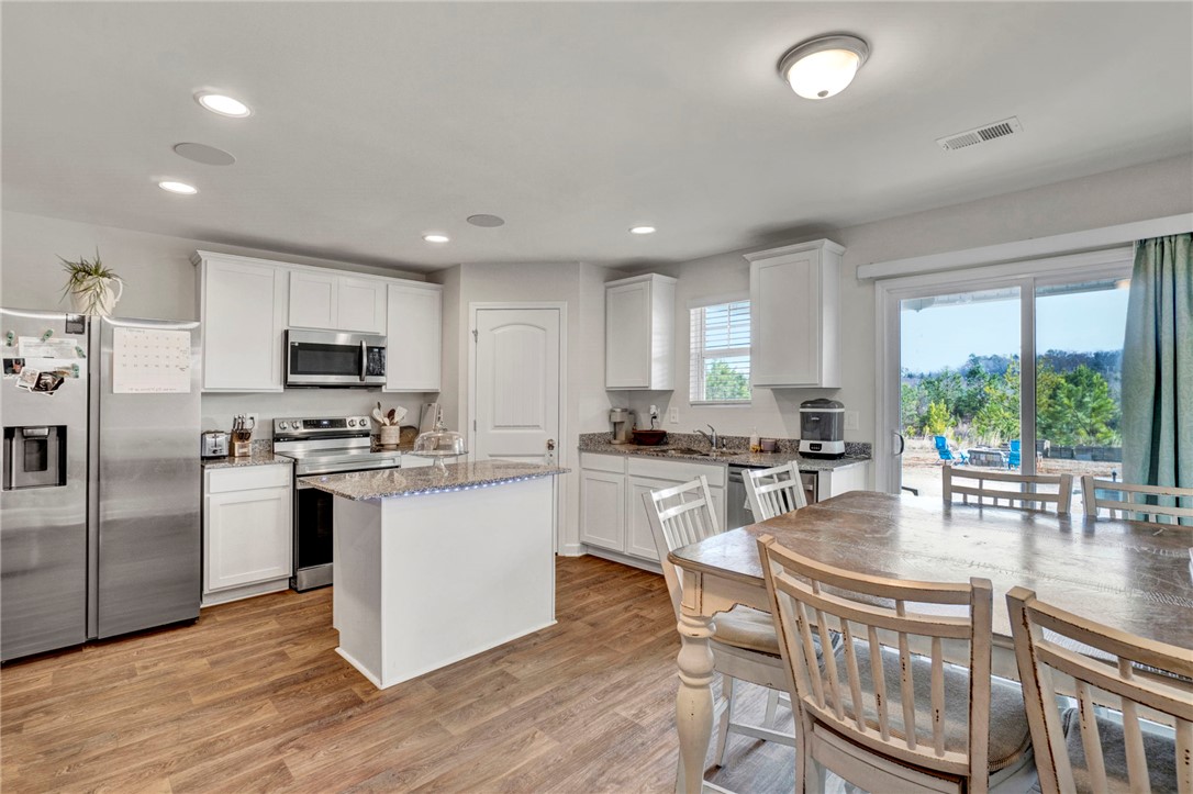 221 Samuel Street Pendleton, SC 29670 - Photo 14 of 34 This bright kitchen offers modern amenities and a seamless connection to outdoor living.