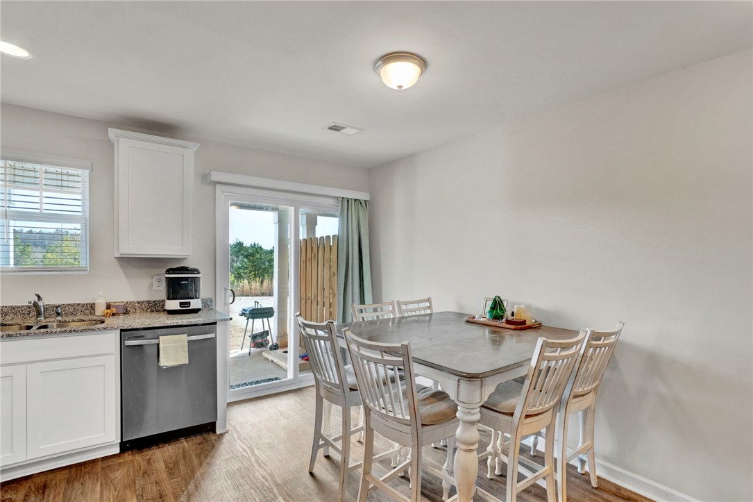 221 Samuel Street Pendleton, SC 29670 - Photo 15 of 34 This bright kitchen offers a practical layout for daily living and easy access to outdoor space.