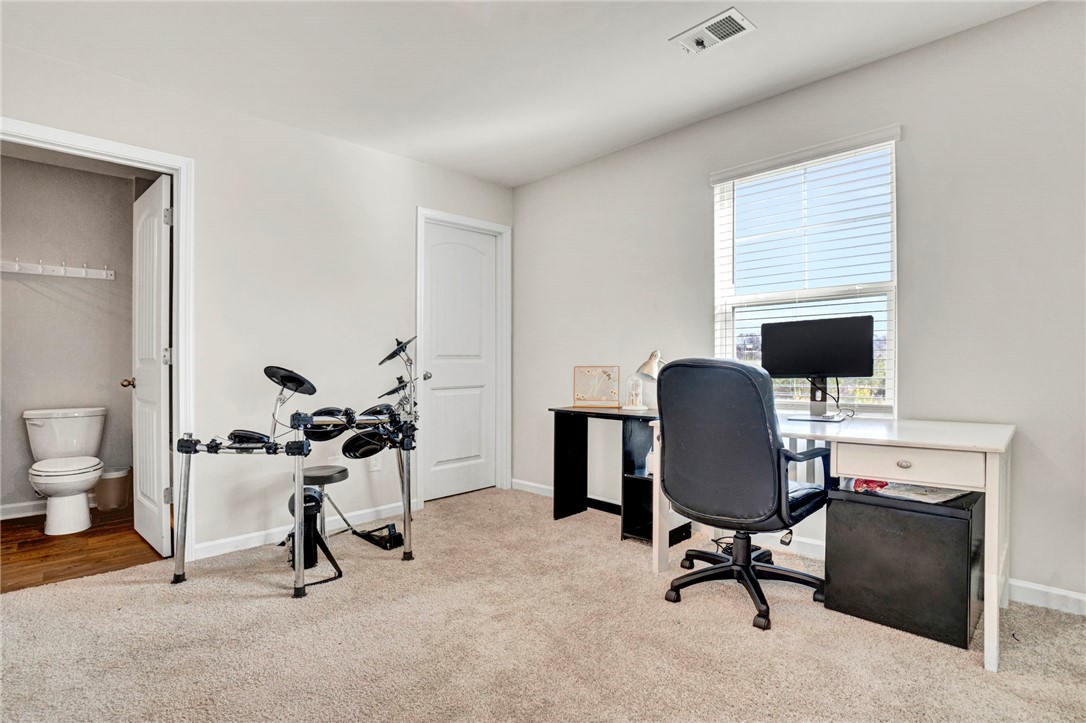 221 Samuel Street Pendleton, SC 29670 - Photo 17 of 34 This versatile room features ample natural light and a practical layout for various uses.
