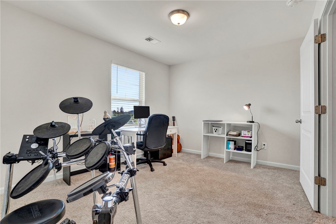 221 Samuel Street Pendleton, SC 29670 - Photo 18 of 34 This versatile room offers a comfortable and functional space.