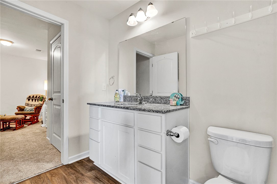 221 Samuel Street Pendleton, SC 29670 - Photo 19 of 34 This bathroom features a sleek vanity and modern fixtures, offering both style and everyday functionality.