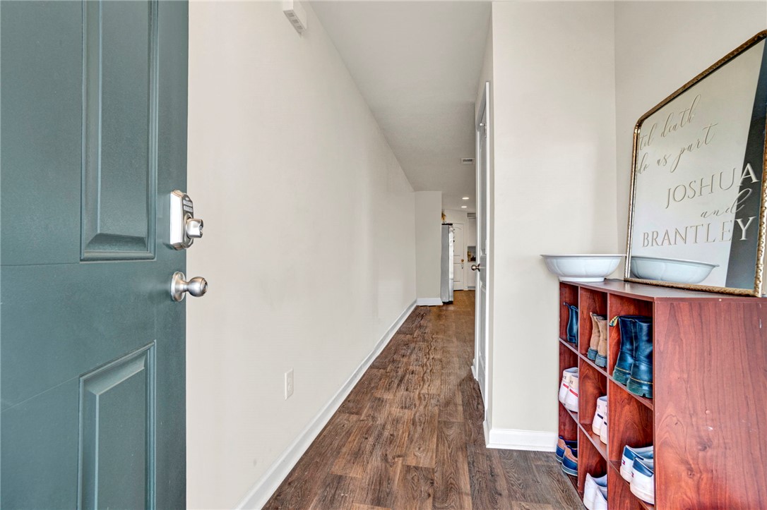 221 Samuel Street Pendleton, SC 29670 - Photo 5 of 34 Step into this welcoming entryway, featuring elegant wood flooring and crisp, clean walls.