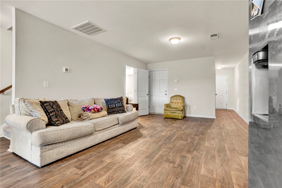 221 Samuel Street Pendleton, SC 29670 - Photo 7 of 34 This inviting space features durable flooring and ample natural light, creating a comfortable atmosphere.