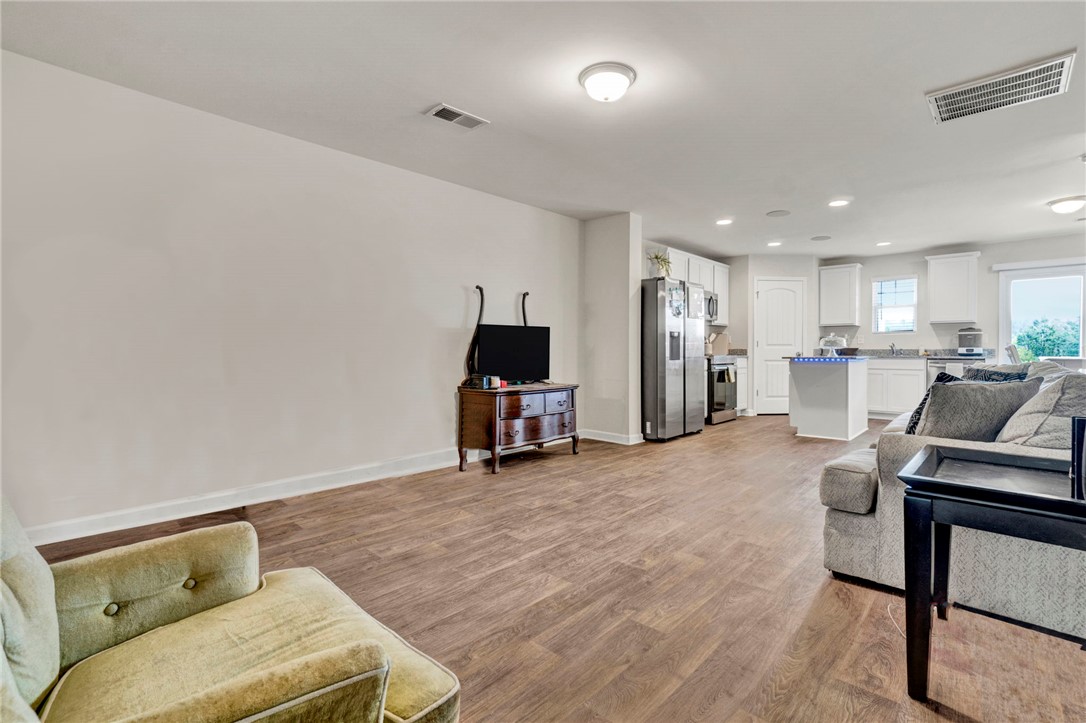 221 Samuel Street Pendleton, SC 29670 - Photo 9 of 34 This inviting space combines comfortable living with a modern kitchen, perfect for everyday enjoyment.