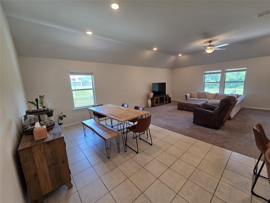 1512 Springtree Drive McKinney, TX 75071 - Photo 9 of 23 a living room with furniture and a wooden floor
