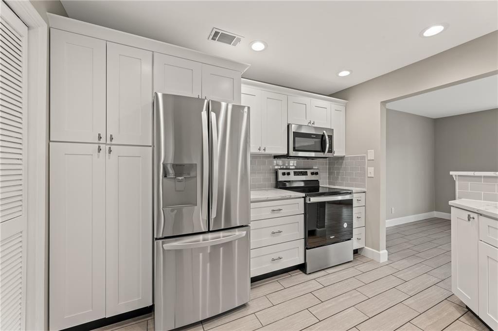 207 Mill Pond Road Roswell, GA 30076 - Photo 1 of 1 Main level kitchen