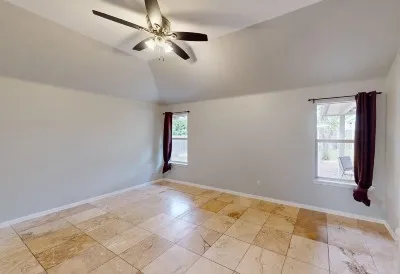 a view of an empty room with a window
