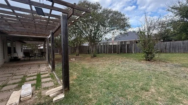 a view of backyard with tree