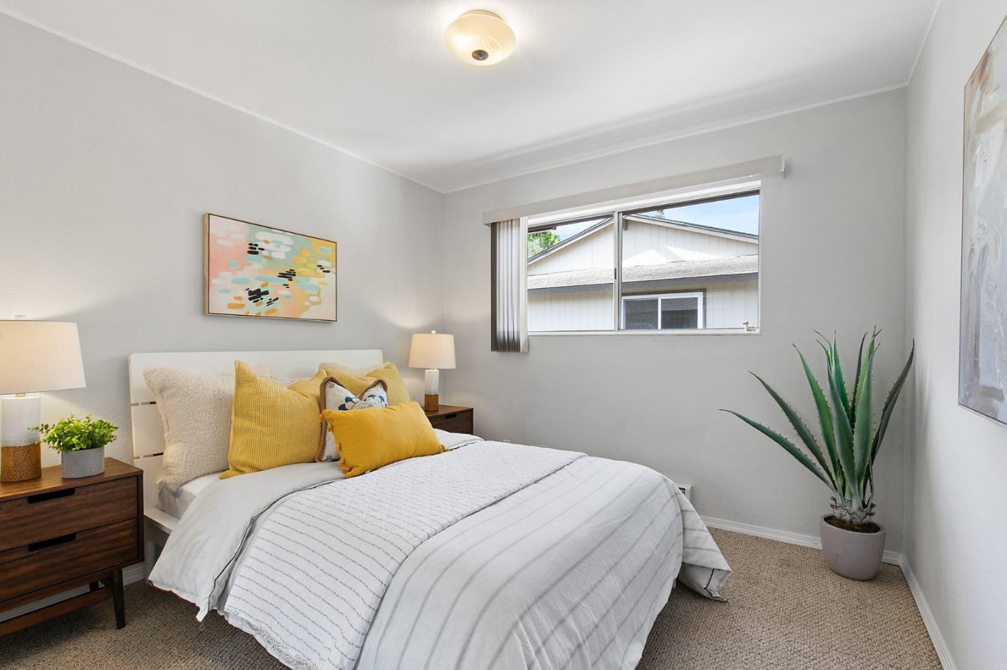 108 East Middlefield Road, Unit D Mountain View, CA 94043 - Photo 12 of 23 a bedroom with a large bed and a window