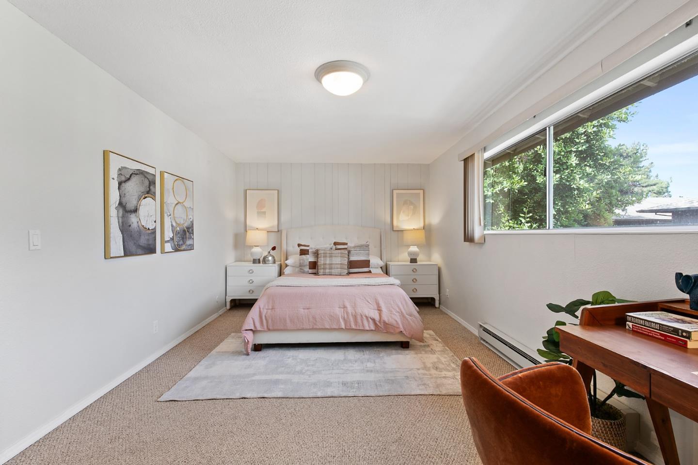 108 East Middlefield Road, Unit D Mountain View, CA 94043 - Photo 16 of 23 a bedroom with a bed and wooden floor